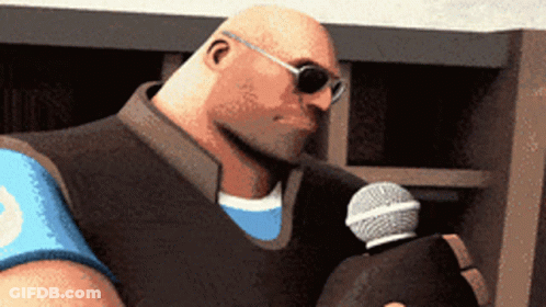Bald Man Wearing Sunglasses Holding Microphone GIF