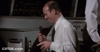 Bald Man White Shirt Black Tie Holding Hammer GIF