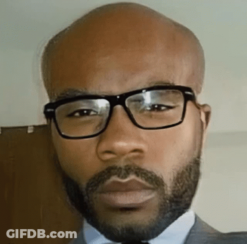 Bald Man With Beard And Glasses In Suit And Tie GIF