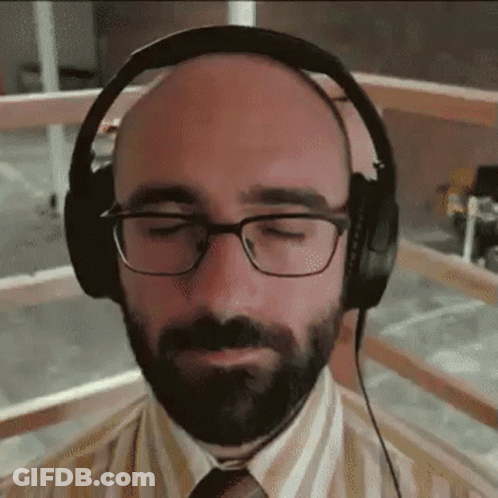 Bald Man With Beard And Glasses Wearing Headphones GIF