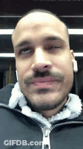 Bald Man With Beard And Mustache Wearing Headphones And Black Jacket GIF