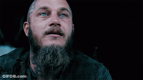 Bald Man With Beard And Tattoos Covering Face GIF