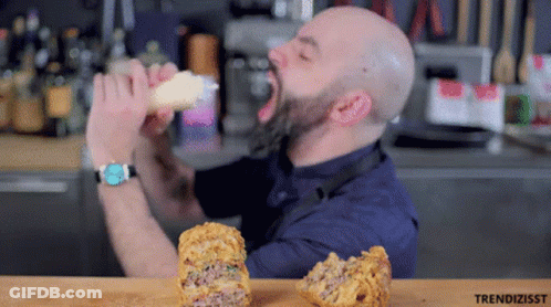 Bald Man With Beard Eating Food GIF