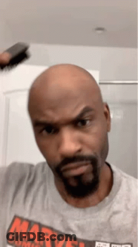 Bald Man With Beard In Gray Marvel Shirt GIF