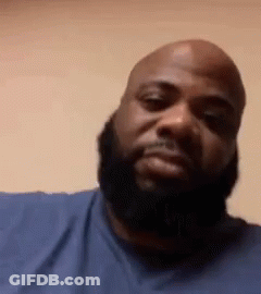 Bald Man With Beard Looking At Camera GIF