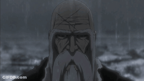 Bald Man With Beard Looking At Camera In Rain GIF