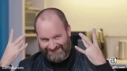 Bald Man With Beard Making Funny Face And Peace Sign GIF