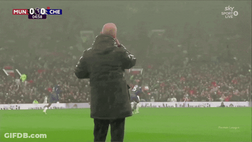 Bald Man With Beard Standing In Front Of Hisense Machine GIF