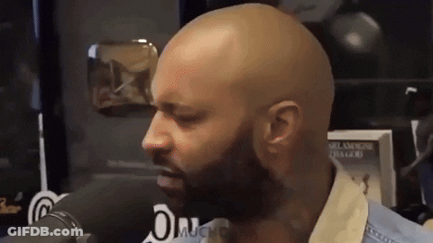 Bald Man With Beard Talking Into Microphone GIF