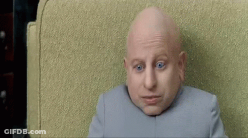 Bald Man With Blue Eyes Looking At Camera GIF