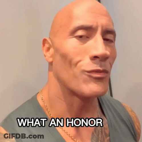 Bald Man With Chest Tattoo Making Funny Face Saying What An Honor GIF