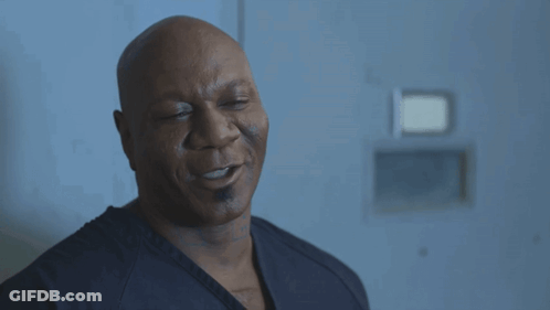 Bald Man With Eyes Closed In Black Shirt GIF