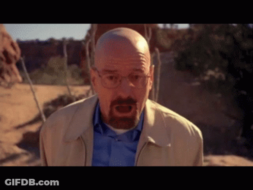Bald Man With Glasses And Beard In Tan Jacket And Blue Shirt GIF