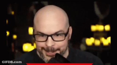 Bald Man With Glasses And Beard Making A Face GIF
