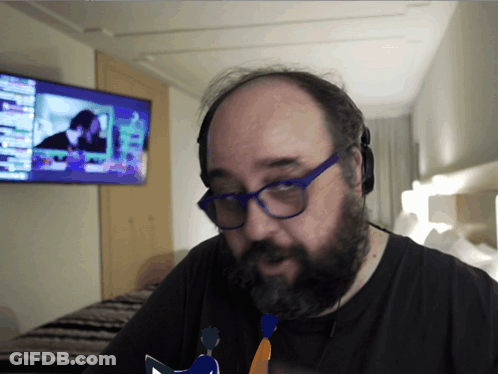Bald Man With Glasses And Beard Watching TV GIF