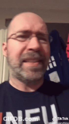 Bald Man With Glasses And Beard Wearing Neu Shirt GIF