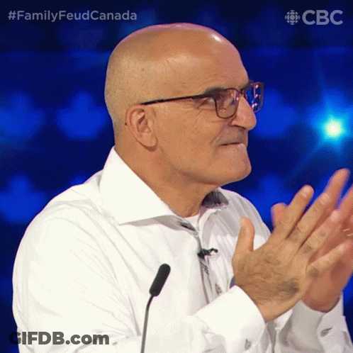 Bald Man With Glasses Applauding At Microphone FamilyFeudCanada GIF