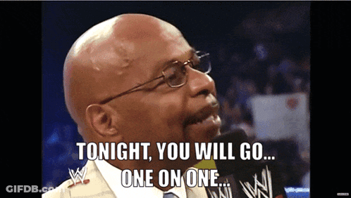 Bald Man With Glasses Talking Into Microphone GIF