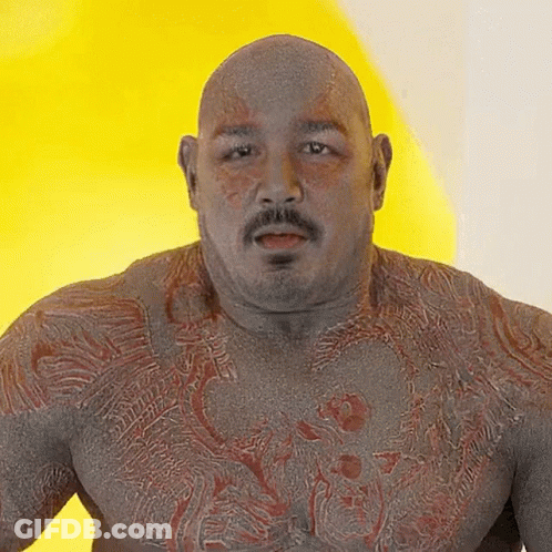 Bald Man With Mustache And Chest Tattoo GIF