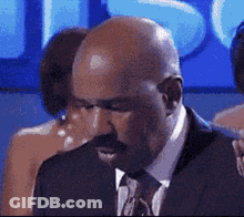 Bald Man With Mustache In Suit And Tie GIF
