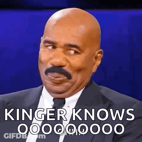 Bald Man With Mustache In Suit Saying Kinger Knows GIF