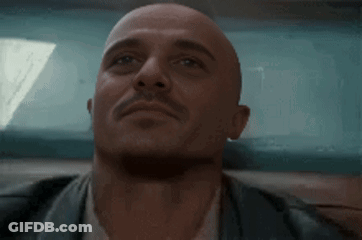 Bald Man With Mustache Looking Up GIF