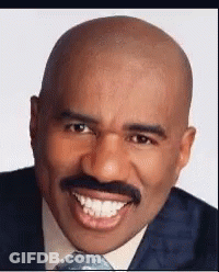 Bald Man With Mustache Smiling In Suit And Tie GIF
