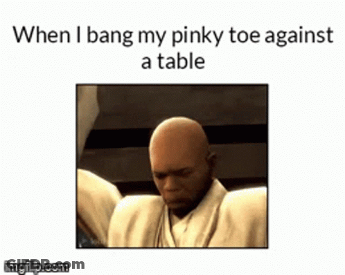 Bald Man With Pinky Toe Against Table GIF