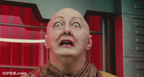 Bald Man With Scarf Looking Up GIF