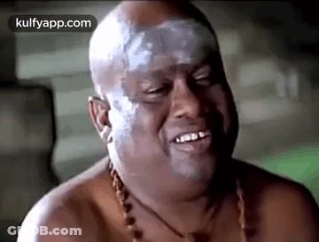 Bald Man With White Paint On Face Smiling And Laughing GIF