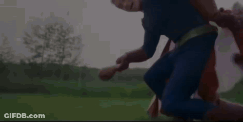 Bald Mustached Man In Suit Covering Mouth GIF
