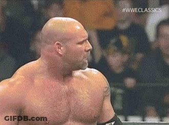 Bald Wrestler Standing In Ring Before Crowd GIF