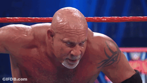Bald Wrestler With Arm Tattoo In Ring GIF