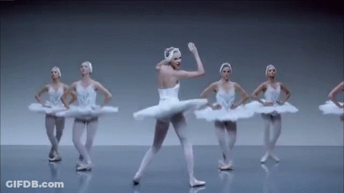Ballerinas Dancing In A Row On Stage GIF