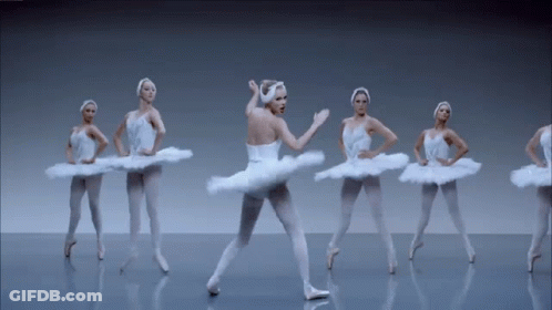 Ballerinas In White Tutus Dancing On Stage GIF