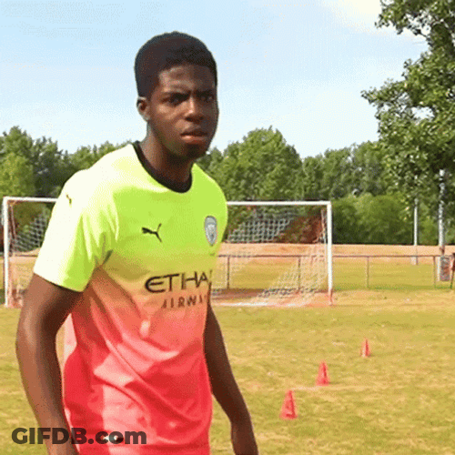 Balogun Looking At Two Hands GIF