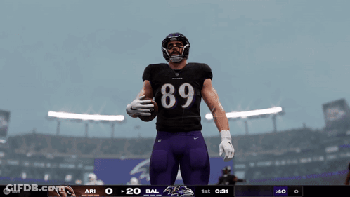Baltimore Ravens Player In Black Jersey And Purple Shorts GIF