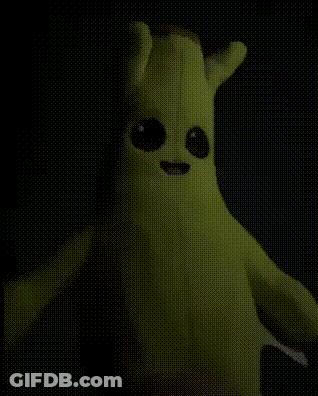 Banana Stuffed Animal With Big Eyes Glowing In Dark GIF