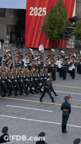 Band Marching In Front Of 2025 Sign GIF
