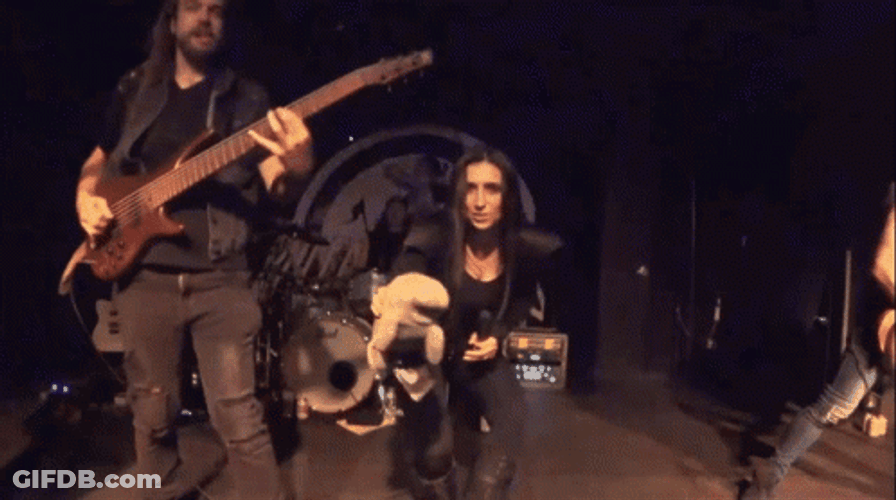 Band Singer Holding A Manatee Toy GIF
