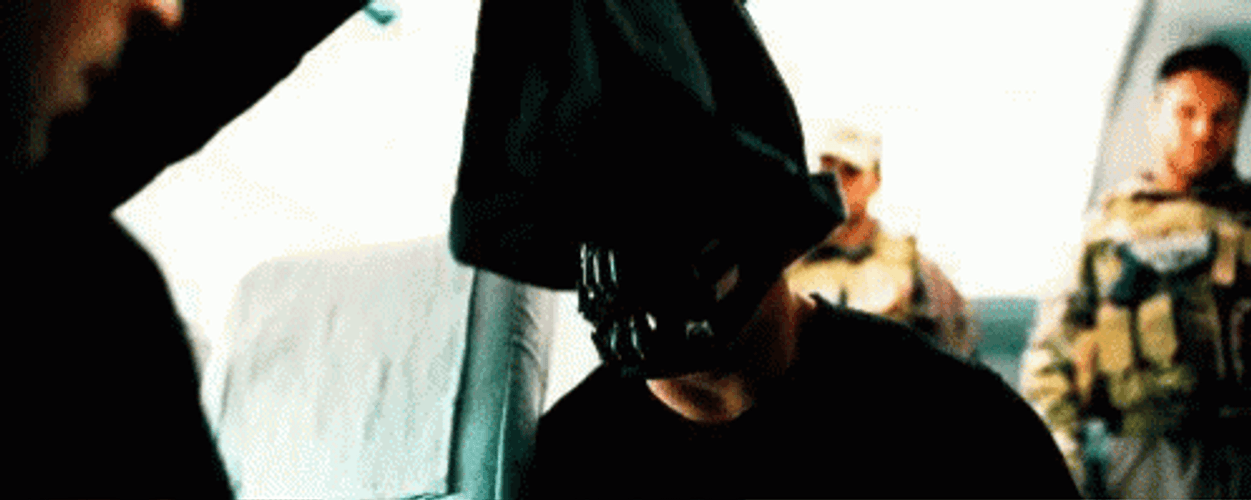 Bane Removes Face Covering GIF
