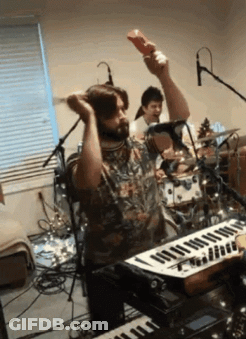 Banging Cowbell With Dance Moves GIF