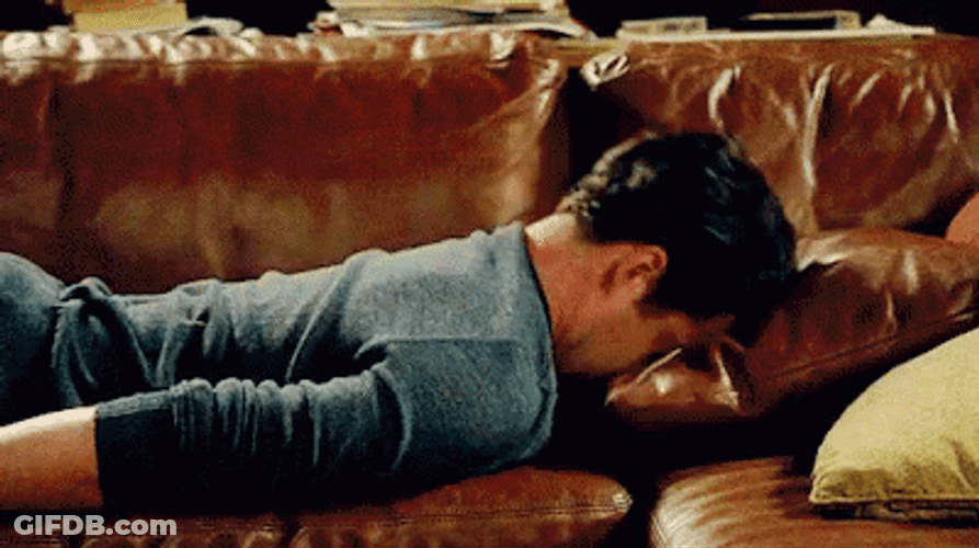 Banging Head Against Wall Guy Lounging GIF