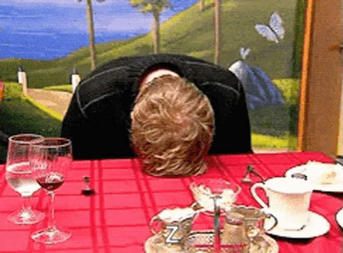 Banging Head On Desk On A Dinner GIF