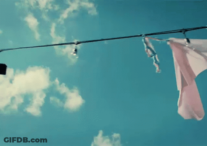 Banner Hanging On Clothesline GIF