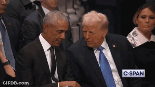 Barack Obama And Donald Trump Sit Next To Each Other In A Crowd GIF