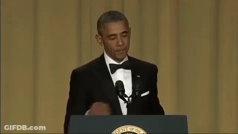 Barack Obama At Podium With Hand On Mouth GIF