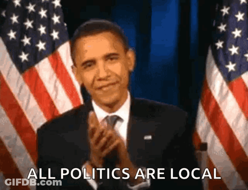 Barack Obama Is Applauding In Front Of An American Flag And Says All Politics Are Local . GIF