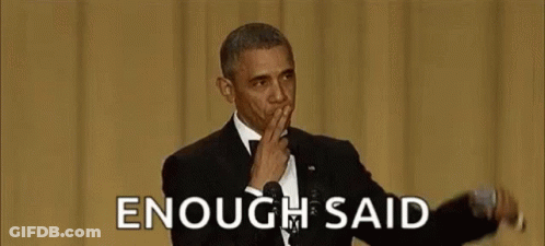 Barack Obama Is Covering His Mouth With His Hand While Giving A Speech At An Event . GIF