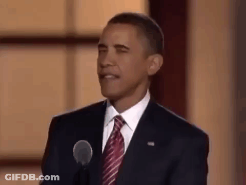 Barack Obama Is Giving A Speech In Front Of A Microphone And Making A Funny Face . GIF